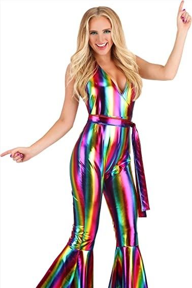 Get ready to boogie the night away in this rainbow rave outfit for women. This jumpsuit features a mock-wrap bodice that has halter ties made of the same fabric. The pants portion has a concealed back zipper to help get the jumpsuit on and off. The pant legs flare widely below the knees for that classic 70s look. Elton John Costume Women, 70s Costume Ideas, Disco Theme Party Outfit, Disco Costume For Women, Disco Party Costume, Pride Dress, Disco Party Outfit, Rave Halloween, 70's Party