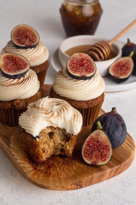 Pumpkins and apples may dominate the autumn season, but don't forget about figs! These fig cupcakes - made with fresh figs, fig jam, olive oil, and brown sugar, all topped off with a swirl of honey cream cheese frosting - are a unique and delicious fall dessert! Figs And Cream Cheese, Desserts With Fresh Figs, Spice Cupcakes With Maple Frosting, Unique Dessert Flavors, Unique Apple Desserts, Fig Preserves Recipe Desserts, Autumn Deserts Ideas, Thanksgiving Dessert Decorations, Brownie Flavors Ideas