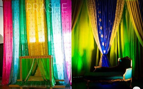 Whether it's the small mehendi at home,  or  a roka function , you may not always be hiring a fancy pants decorator for your big day , and these quick hacks ensure that your humble abode gets that extra kick... Saree Backdrop Ideas, Saree Backdrop Ideas At Home, Diy Sangeet Decor Ideas, Sangeet Photo Booth Ideas, Indian Wedding Background Diy, Simple Sangeet Backdrop, Photobooth For Wedding Indian, Kitty Party Games, Decoration For Ganpati