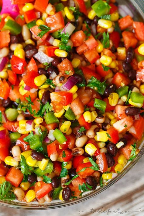 The most colorful salad you will have at your next party or barbecue! Cowboy caviar is like a mashup between salsa and beans. Salsa and beans had a baby and named it cowboy caviar because it's just so hearty and richly delicious! Caviar Cowboy, Cowboy Salad, Caviar Recipes, Cake Cheesecake, Cowboy Caviar, Table For Two, Recipetin Eats, Recipe Video, Salsa Verde