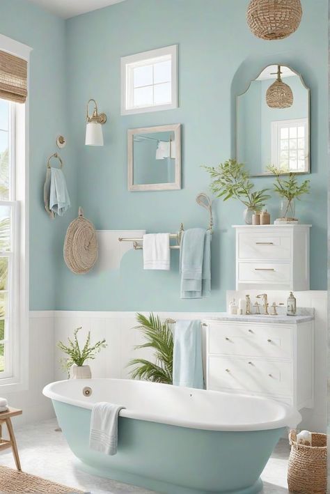 Ever wonder how you can bring the serene beauty of the ocean into your home? Imagine stepping into your bathroom and feeling as if you've been transported to a tranquil seaside retreat. With the right coastal bathroom ideas, you can achieve this serene transformation. From nautical accents to breezy color palettes, these 29 inspiring concepts Modern Beach Cottage Bathroom, White And Aqua Bathroom, Pale Blue Bathroom Walls, Beach Bathroom Colors, Blue Boho Bathroom, Kitschy Bathroom, Sw Watery, Bathroom Aqua, Calming Bathroom