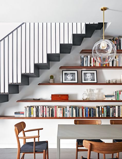 How to make the most of a small space: 11 space-boosting tips | Walnut Kitchen Design, White Walnut Kitchen, White And Walnut Kitchen, Ways To Display Books, Hallway Library, Shelves Under Stairs, Walnut Shelving, Stair Bookshelf, Stair Shelves