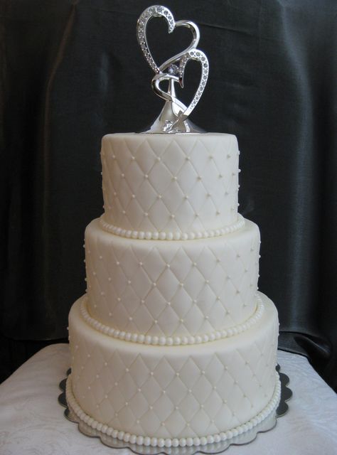 We like the size of the quilt diamonds for our cake tiers. We would like the quilting pattern to NOT be as deep as this cake's quilting. Simple Fondant Wedding Cake, Quilted Wedding Cake, Quilted Fondant Cake, 3 Tier Pearl Wedding Cake, Wedding Cake Pattern, White Ruffle Wedding Cake, Wedding Cake Diamond Pattern, Beaded Wedding Cake, Wedding Cake Beading