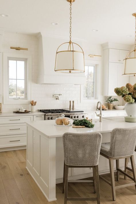 White Islands In Kitchen, Brass And White Kitchen Pendants, Brass Kitchen Island Pendants, Traditional White Kitchen Design, Pendants Over Peninsula Kitchens, White And Brass Pendant Lights Over Kitchen Island, Hanging Island Pendant Lights, White Kitchen Lights, White Kitchen Brass Fixtures