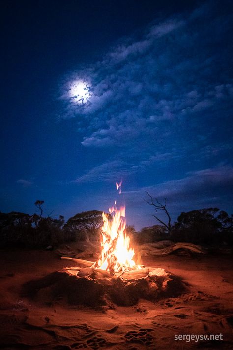 I don't normally do campfires when I travel on my own, but somehow I got into it; and, even more surprisingly, it gave me a whole new world of photographic opportunities. A lot of things came together for this particular image - a near-full moon at just the right height above the horizon, a fine mesh of cotton-candy clouds, and a completely windless night that allowed my little campfire to reach all the way up to the sky. Campfire At Night, Campfire Reference, Twisty Tree, Cabin Painting, Fire At Night, Fire Night, Night Sky Art, Candy Clouds, Night Sky Painting