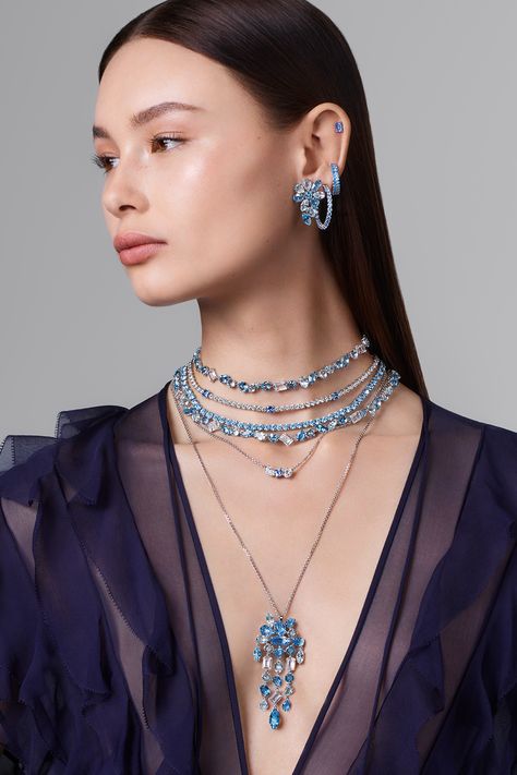 Radiate elegance at every celebration with luminous blue and cool clear crystal creations.​ #Swarovski #CelebrateWonder #CrystalMetamorphosis​ Luxury Blue Crystal Jewelry, Swarovski Star Necklace, Elegant Luxury Blue Crystal Necklace, Swarovski Gema Necklace, Swarovski Millenia Necklace, Crystals Swarovski, Fancy Design, Beautiful Office, Jewelry Designing