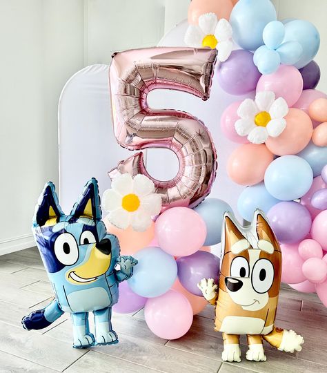 Welcome to Sweet Escapes By Debbie  Make your Bluey-themed party extra special with our Bluey and Bingo Balloon Garland! This colorful and fun balloon garland is the perfect addition to any celebration, bringing the beloved characters Bluey and Bingo to life.  Balloon towers are the perfect way to add that wow to your party. With helium prices increasing and sometimes hard to find this is the perfect balloon option filled with air! This kit includes everything you need to create your tower. This is a great accent or stunning centerpiece for your party. It is also great as a photo prop! Included in each DIY kit: Colors pink, matte blue, melon and blossom ~ 12 11" latex balloons ~ 3 balloon clips ~ One pink number ~ One 12" mylar daisy ~ Glue dots ~ Add on Bluey, Bingo or both! ~ (1) Dual ac Diy Bluey Centerpieces, Bluey Birthday Party Girly, Bluey Party Centerpieces, Bingo Birthday Party Theme, Twoey Bluey Birthday, Bluey Birthday Party Ideas Pink, Diy Bluey Birthday Decorations, Bluey Diy Party, Bluey Balloon Garland