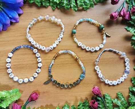 These handmade friendship bracelets are inspired by the titles of Hozier songs. They are great for wearing to concerts, trading with other fans, and giving as gifts to anyone with a love of music. The bracelets are approximately 18cm in diameter on elastic stretch string. Measurements are not exact due to the flexible materials and variation in bead size. If you are concerned about fit feel free to contact me before ordering! SHIPPING: Please note that standard shipping *WITHIN CANADA* does not Hozier Bracelet Ideas, Hozier Friendship Bracelet, Hozier Bracelet, Hozier Songs, Concert Bracelets, Hozier Concert, Beaded Friendship Bracelets, Unreal Unearth, Love Of Music