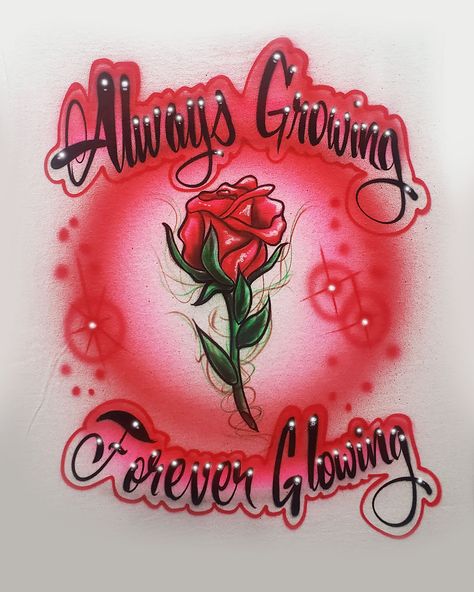 An awesome airbrushed t-shirt, painted with a colorful ROSE design that can be personalized with a name or short phrase.  Design can be painted on the front or back of the shirt.  Some recommended color combinations that look great with this design are:  red-yellow, pink-red or green-yellow; but I'm happy to use whatever colors you request!  I start with great-quality t-shirts, and only paint using the highest-quality airbrush paints that hold up VERY well when washed.  I recommend turning your shirt inside out and machine washing in cold water.  Always hang-dry your shirts to keep the colors nice and bright.  Once your design is painted, it is heat-pressed to seal your design for the life of your shirt.   I have over 32 years of airbrushing experience, and I always try to provide great ar Couples Airbrush Shirts, Airbrush Wallpaper, Airbrush Lettering, Airbrush Shirts, Airbrush T Shirts, Cars Birthday Invitations, Airbrush Designs, Cholo Art, Halloween Wallpaper Cute