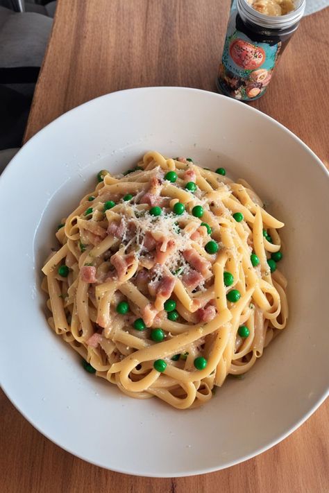 Pasta Carbonara with Peas Recipe

Ingredients

- 8 ounces spaghetti
- 1 cup frozen peas
- 4 ounces pancetta or guanciale, diced
- 2 large eggs
- 1 cup grated Parmesan cheese
- Salt and black pepper to taste
- Fresh parsley, chopped (for garnish)

Instructions

- Cook spaghetti according to package instructions in salted water. Add peas during the last 2 minutes of cooking; drain and reserve some pasta water. 
- In a large pan, cook pancetta over medium heat until crispy. In a bowl, whisk together eggs and Parmesan cheese until smooth. 

Full Recipe on... Peas And Pancetta Pasta, Pancetta Pasta Recipes, Pasta Carbonara With Peas, Carbonara With Peas, Spaghetti Dishes, Pancetta Pasta, Boiling Pasta, Peas Recipe, Traditional Italian Dishes