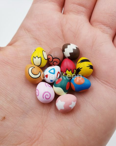 Hand sculpted and hand painted little Pokemon Eggs. Pikachu Polymer Clay, Egg Clay Art, Pokémon Egg, Pokémon Pottery, Pokemon Air Dry Clay, Pokemon Clay Ideas, Pokemon Diy Gifts, Pokemon Polymer Clay, Polymer Clay Pokemon