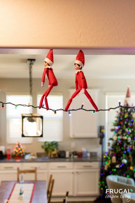 Get ready to take your Elf on the Shelf game to new heights with a whimsical and enchanting idea that will leave your kids wide-eyed and full of wonder. The Elf on the Shelf Tightrope Walker is not only a magical addition to your holiday traditions but also a setup that will have your little ones asking, "How did he do that?" Follow our step-by-step guide to create this festive and gravity-defying scene in your home. New Elf on the Shelf ideas daily plus free Elf on the Shelf printables. Elf In The Shelf Ideas Toddler, Brother Elf On The Shelf Ideas, Elf On The Shelf Plane Ideas, Elf On Shelf Ideas With 2 Elves, Elf On The Shelf Riding Dinosaur, Elf Arrival For Older Kids, Green Elf On The Shelf, Elf On The Shelf Outdoor Ideas, Elf Of The Shelf For Toddlers