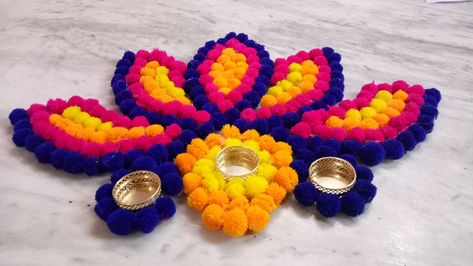 Pompom rangoli Pom Pom Rangoli Designs, Divali Decoration, Bommala Koluvu, Diwali 2024, Flowers Rangoli, Diya Decoration Ideas, Diwali Candles, Diy Floral Decor, Dresses Couture