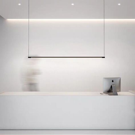 Looking to achieve that designer or architectural look with a modern light fixture that is both sleek and functional for either an urban home or commercial application? This black minimalist linear LED pendant fixture is suspended with wires to give the illusion of invisibility without any extra frills for simple sophistication. Perfect for hanging over a dining table, boardroom table, kitchen counter, bar, work surface or reception counter. Is Bulbs Included: Yes, Power Source: AC, Installation Linear Pendant Light, Reception Counter, Boardroom Table, Suspended Lighting, Black Minimalist, Counter Bar, Minimalist Lighting, Pendant Fixture, Linear Lighting