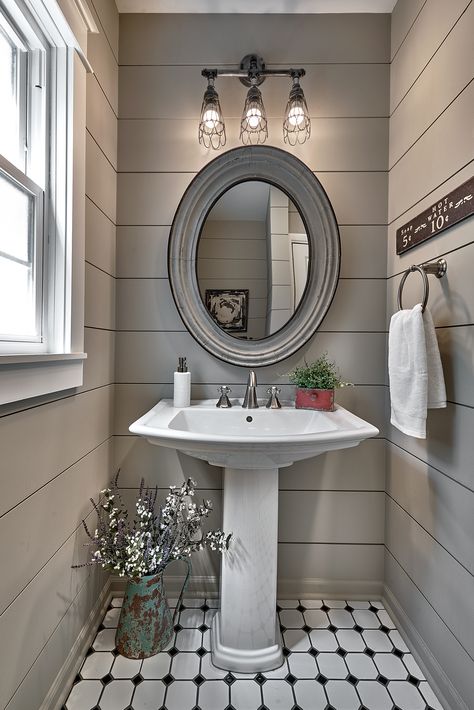 A farmhouse inspired powder room renovation with shiplap walls, pedestal sink, black and white patterned tile, and a rustic mirror and light fixture. Powder Room With Pedestal Sink, Comfy Bathroom, Pedestal Sink Ideas, Pedestal Sink Powder Room, Farmhouse Powder Room, Small Half Bathroom, Powder Room Renovation, Pedestal Sink Bathroom, Walls Design