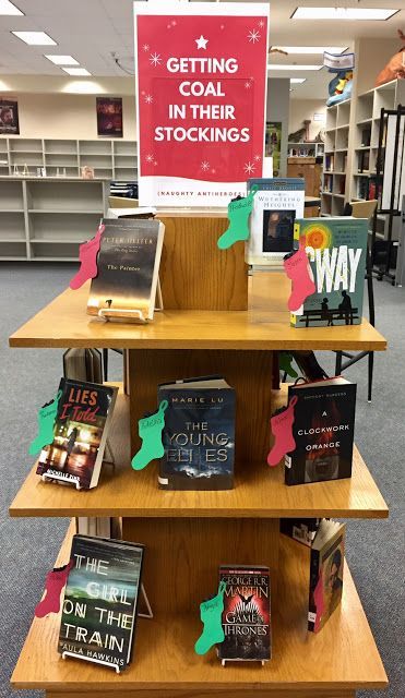 By Michelle Reid Thanks to Michelle for sharing her Christmas display idea - great to see something a bit different!Here are her comments:'This year I flipped our holiday-themed display to feature cha Library Ornaments, Book Display Ideas Library, Library Aide, Christmas Library Display, Teen Library Displays, Readers Advisory, School Library Book Displays, Winter Displays, Christmas Library