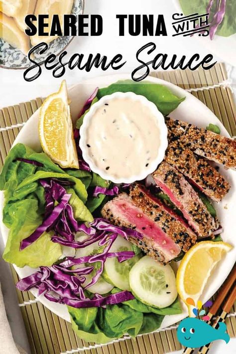 Ahi Tuna is coated in black and white sesame seeds and quickly seared in butter. Served on a bed of lettuce with a creamy sesame sauce, this dish is a win-win! Seared Yellowfin Tuna, Ahi Tuna Sauce, Sesame Dipping Sauce, Fresh Fish Recipes, Easy Fish Dinners, Raw Tuna, Seared Ahi, Seared Tuna, Tropical Food