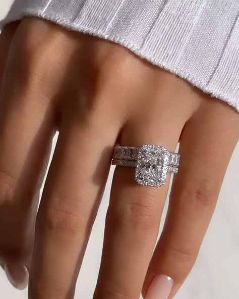 Nuno Rocha on Instagram: "Introducing this breathtaking @diamondboi engagement ring, a true masterpiece that exudes elegance and sophistication. This exquisite ring features a dazzling 2.00ct radiant cut diamond, expertly placed in a cut cornered halo setting, accentuating its brilliance and fire. The halo design adds a touch of glamour and creates a mesmerizing focal point. To complete the ensemble, this stunning ring is paired up with a radiant cut eternity band, showcasing a continuous row of radiant cut diamonds, symbolizing eternal love and commitment. Crafted with meticulous attention to detail, this @diamondboi engagement ring is a testament to timeless beauty and impeccable craftsmanship, making it the perfect symbol of your everlasting love story. Why join the @diamondboi family Radiant Halo Engagement Ring With Band, Radiant Engagement Ring With Halo, Radiant Eternity Band, Radiant Cut Engagement Ring With Band, Engagement Rings And Wedding Bands Set, Radiant Halo Engagement Ring, Radiant Wedding Rings, Radiant Cut Halo Engagement Ring, Radiant Cut Engagement Ring