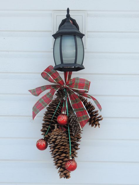 add a swag on our back porch light during the holidays Outdoor Holiday Planters, Christmas Lamp Post, Christmas Flower Decorations, Holiday Planter, Christmas Pine Cones, Christmas Lamp, Winter Porch, Holiday Deco, Porch Light