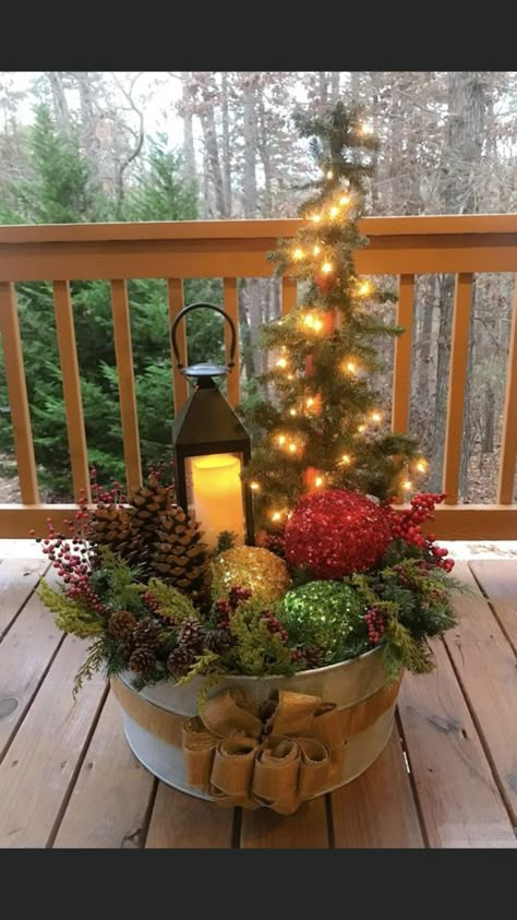 If you want to create an awesome festive outdoor scene but don't want to break the bank, then follow these tutorials for some awesome outdoor Christmas decorations you can make in no time! Ranch Christmas Decor Outdoor, Christmas Wheelbarrow Ideas, Cowgirl Christmas, Cowboy Santa, Christmas Country, Porch Decorations, Winter Porch, Christmas Planters, Country Christmas Decorations