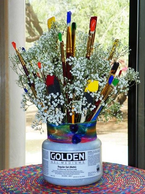 An artist's bouquet Art Center Piece Ideas, Art Museum Party Theme, Art Supply Centerpieces, Artist Centerpiece Ideas, Artist Graduation Party, Art Themed Graduation Party, Paint Can Centerpiece Ideas, Artist Party Theme, Art Gallery Party Theme