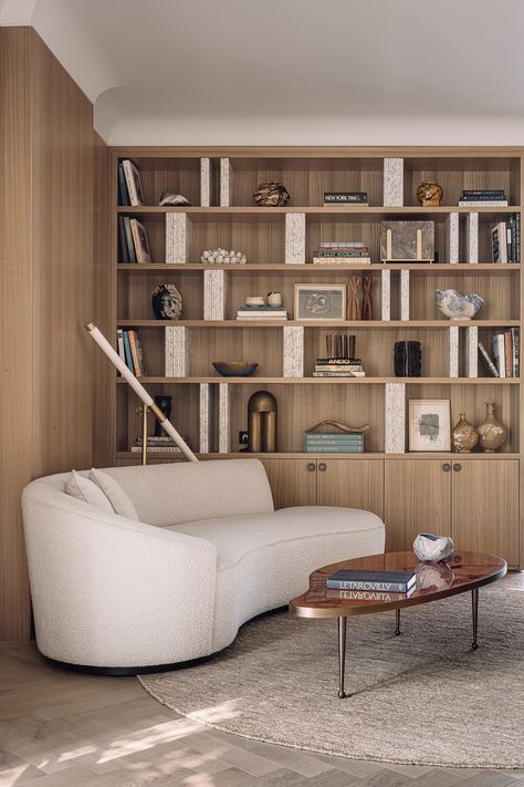 DeMuro Das - JORBAGH VILLA Living Room With Library, Room With Library, Chevron Pattern Floor, Earthy Palette, Curved Sofa, Wood Panel Walls, Office Room, Floor Patterns, Home Library