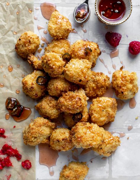 Baked popcorn chicken is super crispy and crunchy and baked! Serve with a drizzle or dip of fresh raspberry hot honey for extra zing. Baked Popcorn, Crispy Chicken Bites, Purple Popcorn, Baked Crispy Chicken, Chicken Photography, Baked Popcorn Chicken, Nugget Recipes, Pretzel Crusted Chicken, Chicken Crisps