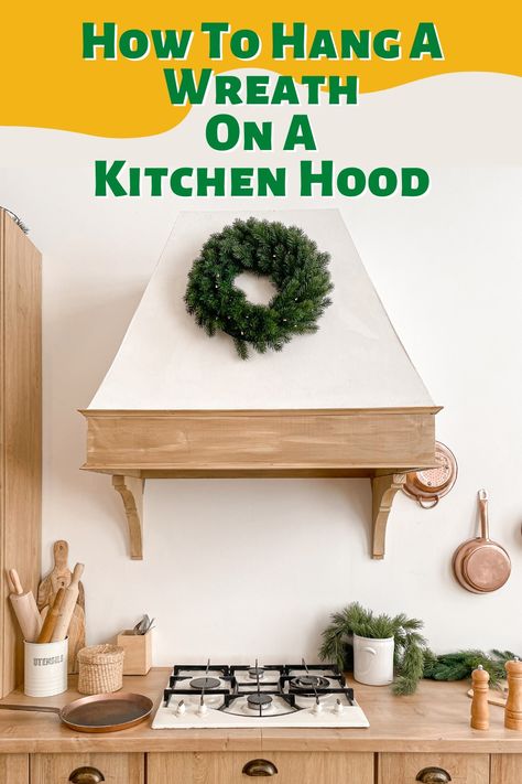 One of the most unique ways to display a wreath is in the kitchen, on your kitchen hood. Doing so can dramatically up the bonafide holiday vibes of your kitchen decor. ... . #range #rangehood #christmas #xmas #wreath #christmasdecorating #christmastime #kitchendecor #kitchen #festive Wreath On Stove Hood, Wreath On Kitchen Hood, Stove Hood Christmas Decor, Wreath On Oven Hood, Kitchen Hood Christmas Decor, Wreath On Vent Hood, Kitchen Range With Christmas Wreath, Wreath Above Stove, Wreath Above Stove Vent Hood