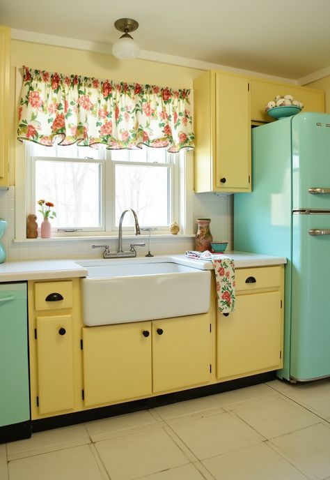 Step into a charming vintage-inspired kitchen filled with character! 🌼✨ Bright pale yellow cabinetry and retro-style appliances in soft pastels create a warm ambiance. The white tile countertops and large farmhouse sink, framed by floral curtains, evoke nostalgia. A vintage fridge completes this delightful, colorful haven! Soft Yellow Kitchen, White Tile Countertops, Pastel Yellow Kitchen, Yellow Vintage Kitchen, Large Farmhouse Sink, Yellow Refrigerator, Vintage Yellow Kitchen, 1950 Kitchen, Yellow Kitchen Cabinets