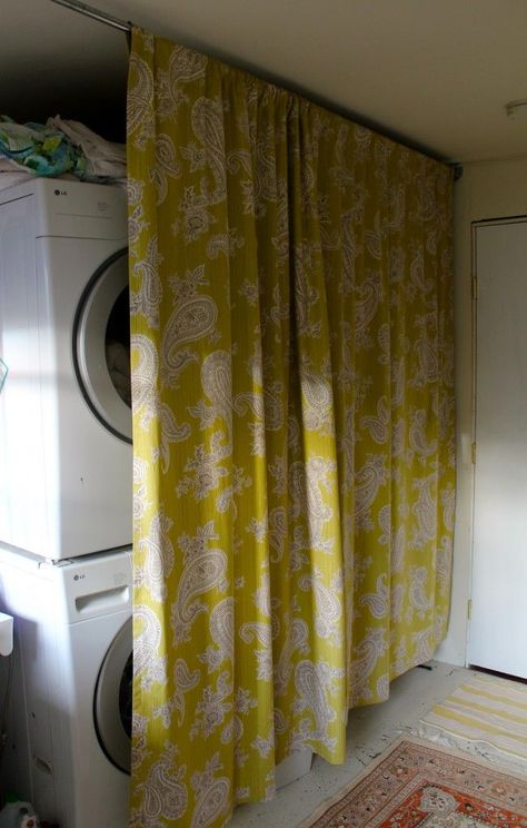 Stacked washer and dryer hidden by a yellow paisley curtain Curtains To Hide Washer And Dryer, Hide Washer And Dryer, Laundry Room Organizing, Small Washer And Dryer, Hidden Laundry Rooms, Laundry Room Curtains, Hide Appliances, Paisley Curtains, Laundry Nook