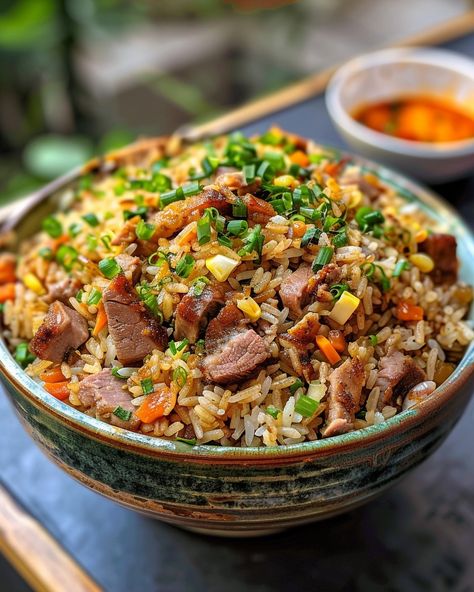 PORK FRIED RICE 🍚🐖 Ingredients: 2 cups cooked white rice (preferably day-old) 1 cup cooked pork, diced 1/2 cup frozen peas and carrots 1/2 cup diced onion 2 cloves garlic, minced 2 eggs, lightly beaten 3 tbsp soy sauce 2 tbsp vegetable oil 1 tbsp sesame oil 2 green onions, sliced Salt and pepper to taste Directions: Step 1: Prepare Ingredients Gather and prepare all your ingredients. Ensure the rice is cooked and cooled, the pork is diced, and the vegetables are ready... White Rice With Vegetables, Fried Rice Pork, Cool Foods, Frozen Peas And Carrots, Cooked White Rice, Rice Meals, Pork Fried Rice, Peas And Carrots, Rice Food