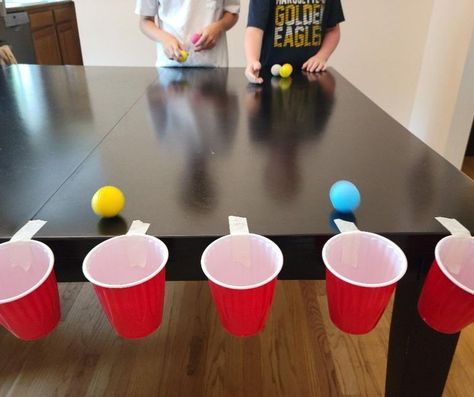 Easy Nye Games For Kids, Christmas Toss Game, Christmas Team Games For Kids, Cup Pong Christmas Game, Christmas Games For Family With Ping Pong Balls, Minute To Win It Cup Stacking, Minute To Win It Games With Ping Pong Balls, Red Solo Cup Party Games, Solo Cup Balloon Game