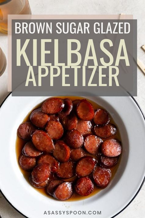 A white bowl with easy kielbasa bites in it with the words "brown sugar glazed kielbasa appetizer" in the foreground Crockpot Keilbasa Recipes, Kielbasa Bites Appetizers, Glazed Kielbasa Bites, Brown Sugar Kielbasa, Kielbasa Bites Recipe, Kielbasa Crockpot, Kielbasa Appetizer, Kielbasa Bites, How To Cook Kielbasa