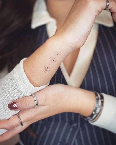 Fine line stars tattoo on the wrist. 3 Stars Tattoo Wrist, Line Stars Tattoo, Stars In A Line Tattoo, Wrist Fine Line Tattoos For Women, Stars Wrist Tattoos For Women, Stars With Initials Tattoo, Fine Line Tattoo Ideas Stars, Fine Wrist Tattoo, Fineline Wrist Tattoos For Women