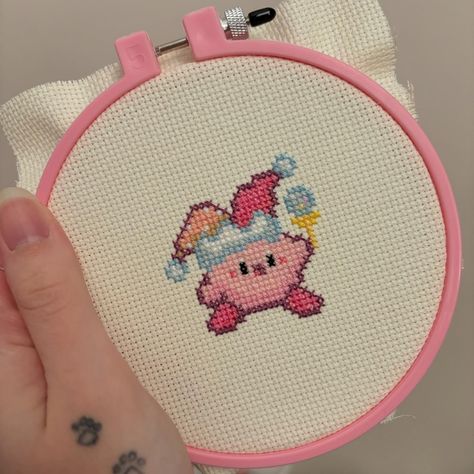 Not crochet content tonight, because I had to share my first cross stitch project! Awhile ago I taught myself how to cross stitch using a pattern from @colorfully.sarah I just picked a small part from her Kirby pattern so I could stay motivated to finish. I love my new Kirby buddy and can’t wait to incorporate this into my crochet too 🙏 . . #fiberart #fiberartist #kirby #crossstitch Korean Cross Stitch, Kirby Embroidery, Kirby Cross Stitch, Kirby Pattern, Pink Cross Stitch, Kawaii Cross Stitch, Small Cross Stitch, Thread Art, Cute Embroidery