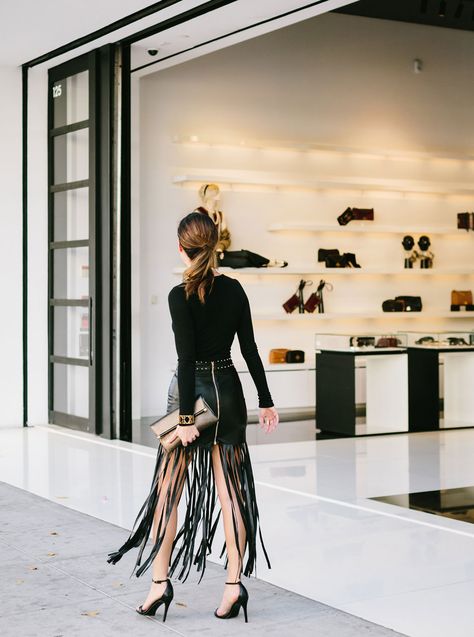 Sydne Style wears a black leather fringe mini skirt Black Fringe Skirt Outfit, Fringe Dress Outfit, Fringe Skirt Outfit, Ruffle Skirt Outfit, Nails Essie, The Letter F, Fall Winter Fashion Trends, Wear Red Lipstick, Shoes Steve Madden