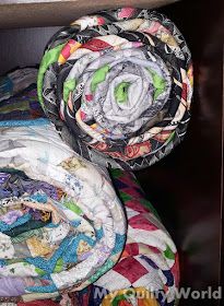 My Quilty World: Rolling a Quilt for Storage Folding A Quilt For Storage, How To Store Quilts, How To Fold A Quilt For Storage, Folding Quilts For Storage, Quilt Storage Ideas, How To Roll, Bonnie Hunter, Quilt Storage, Quilt Stores