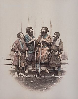 The two men in the middle are holding rifles. The second man from the right is wearing an apron with a knife (?). The man on the right is wearing earrings and carrying a knife sheath at his waist. The man on the left is probably holding a hatchet. (This is the same as photograph #3966). Ainu People, Golden Kamui, An Apron, Meiji Period, Ethnic Art, Knife Sheath, Nagasaki, Two Men, Fantasy Inspiration