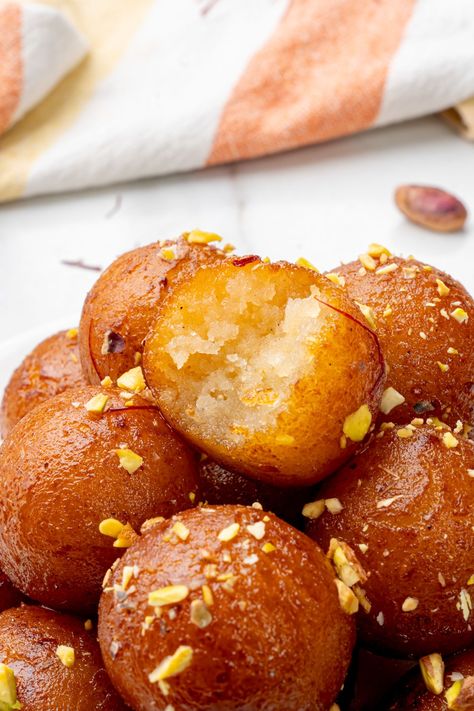 Gulab jamuns garnished with nuts Galub Jamun, Gulag Jamun, Indian Deserts, Deep Fried Donuts, Dessert Balls, Gulab Jamun Recipe, Jamun Recipe, Plating Ideas, Rose Flavored