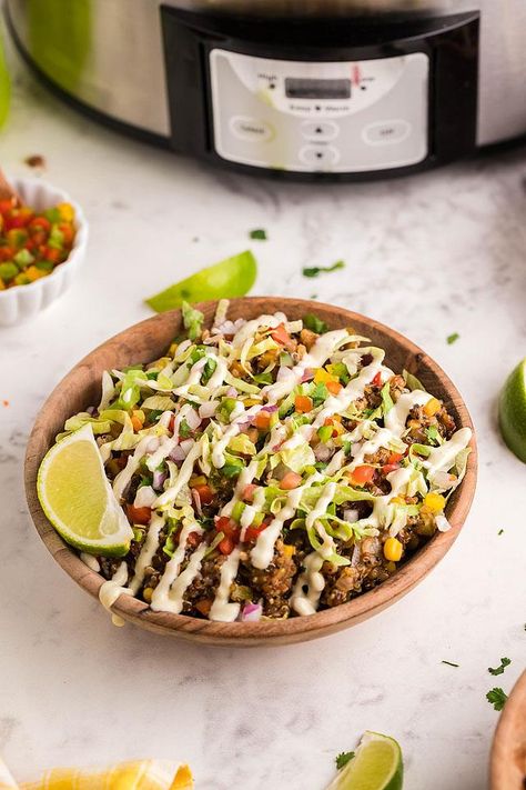 Slow cooker Tex Mex quinoa taco bowls boast the most amazing flavours. It’s a colourful southwest inspired taco bowl packed with south of the border character. A crockpot is your friend for this quinoa slow cooker recipe. This crockpot Mexican quinoa recipe is a great addition to the weeknight dinner menu. This slow cooker Tex Mex quinoa taco bowls recipe. It is a tasty vegetarian or vegan slow cooker recipe that is packed full of southwest flavour. #slowcooker #crockpot #vegan #quinoa Quinoa Slow Cooker Recipes, Tex Mex Quinoa, Crockpot Vegan, Crockpot Mexican, Quinoa Tacos, Taco Bowl Recipe, Vegan Slow Cooker Recipes, Quinoa Dishes, Mexican Quinoa