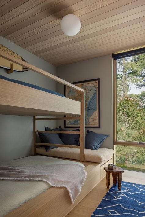 Bedrooms are tucked away at the back of the home. Amagansett House, Bed With Window, Max Strus, Thomas Bedroom, Beach Bedrooms, Coastal Bungalow, Murphy Bunk Beds, Custom Bunk Beds, Beach Chalet