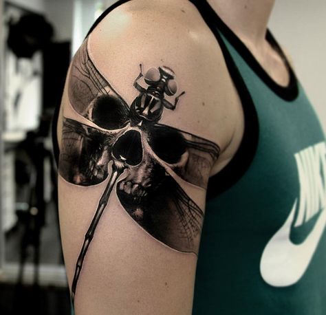 Dragonfly Skull by Richard Feodorow, an artist at Ivory Tower Tattoo in Gothenburg, Sweden. Bug And Skull Tattoo, Men’s Dragonfly Tattoo, Dragonfly Tattoo Design For Men, Dragonfly Skull Tattoo, Mens Dragonfly Tattoo, Dragonfly Tattoo Men, Black Dragonfly Tattoo, Upper Sleeve Tattoo, Tower Tattoo