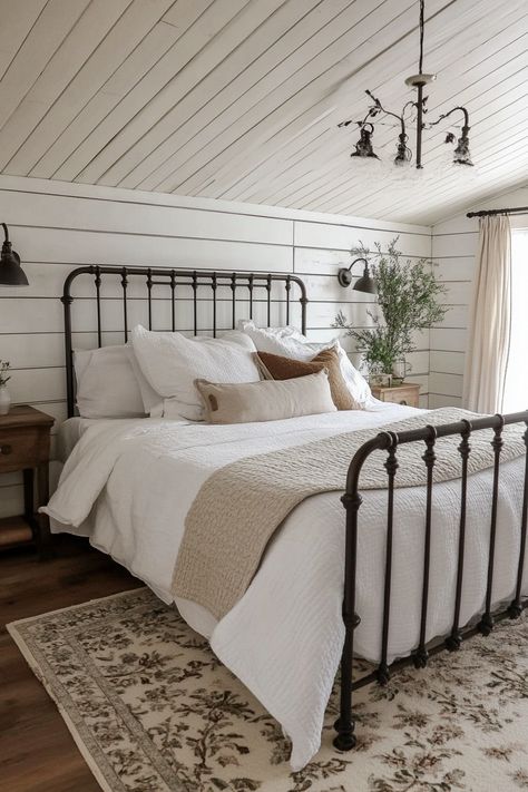 Rustic-chic bedroom. White shiplap ceiling, wrought iron bed frame with natural linen bedding.

Welcome to the latest trend in home design that combines both style and functionality seamlessly - modern farmhouse sleeping spaces with sliding barn doors! This rustic-chic decor has taken the interior design world by storm, promising a unique blend of snug comfort and stylized appeal. You definitely won't be disappointed!…

Read more: https://tastyinteriors.com/generated-post-73-modern-farmhouse-sleeping-spaces-sliding-barn-doors/ Wrought Iron Bed Frame Ideas, Black Metal Farmhouse Bed, Farmhouse Bedroom Metal Bed, Bedroom With Wrought Iron Bed, Wrought Iron Bedroom Ideas, Iron Bed Frame Bedroom, Iron Beds Bedroom Decorating Ideas, White Shiplap Ceiling, Farmhouse Master Bed