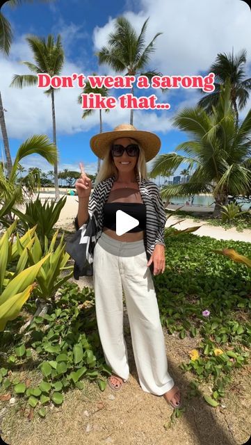 Monica D 🌺 Hawaii 🏖 Beach on Instagram: "I bet you didn’t think of that!
*
Here’s an easy fashion hack to make a blouse from a sarong / pareo !
*
Very handy when you are traveling only with your carry on , all you need is a sarong or oversized scarf and first you can use it as a cover up for the beach and after the beach you can easily transform it into a blouse! All you need is a hair tie! Wear it with some linen pants and you are ready for any occasion!
*
Fold your sarong in half. Gather the fabric together so it looks like a pretty flower, use a hair tie to tie it together . Place the flower on top of your shoulder, drape one end in front of you and the other end on your back . Grab the end on the back , bring them to the front and tie them together. My scarf is pretty big so i decide How To Tie A Sarong, Sarong Tying, Beach Ware, Easy Fashion, Linen Scarves, Swimming Outfit, Oversized Scarf, Pretty Flower, Scarf Tying