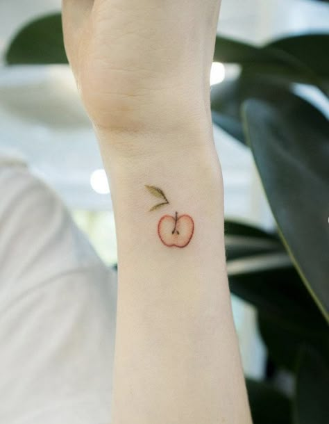 Apple Seed Tattoo, Small Apple Tattoo Ideas, Eve Apple Tattoo, Half Apple Tattoo, Realistic Apple Tattoo, Simple Apple Tattoo, Apple Of My Eye Tattoo, Tiny Fruit Tattoo, Apple Pie Tattoo