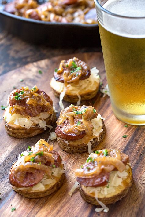 These Oktoberfest potato stacks are topped with sauerkraut, smoked sausage and beer-braised onions for loads of savory, festive flavor in each bite! | thecozyapron.com #oktoberfest #oktoberfestpartyfood #oktoberfestfood #oktoberfestpotatoes #oktoberfestrecipes #oktoberfestrecipesappetizers #oktoberfestpotatostacks German Party Food, Braised Onions, Vintage Oktoberfest, Oktoberfest Menu, German Appetizers, German Snacks, Octoberfest Party, German Party, German Things