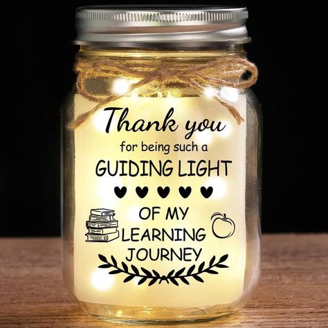 PRICES MAY VARY. Unique Gift for Teacher: Illuminate Teacher's special occasions with our 16oz Lighted Mason Jar. This beautiful and decorative gift is perfect gift to express your love to your teacher as a warm gifts for birthday, Christmas, Teacher's day, Valentine's day, Easter, Thanksgiving Day, anniversary or just a daily surprise gift Teacher Appreciation Gifts: Express your love with the warm message on this teacher gift: THANK YOU FOR BEING SUCH A GUIDING LIGHT OF MY LEARNING JOURNEY, i’ Lighted Mason Jars Christmas, Teacher Gift From Student Teacher, Mason Jar Teacher Gifts Christmas, Homemade Appreciation Gifts, Gifts For Mentor Teacher From Student Teacher, Thanksgiving Teacher Gifts Ideas, Circuit Teacher Gifts, Cute Gift Ideas For Teachers, Thanksgiving Gift Ideas For Teachers