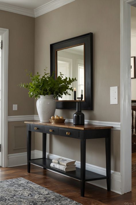 Elevate your entryway with a sleek and contemporary foyer design that exudes elegance and sophistication. This inviting space is curated to make a memorable first impression with its blend of modern aesthetics and chic decor elements. Perfect for welcoming guests with style and flair. #ModernDesign #ChicFoyer #InteriorInspo #FirstImpression #EntrywayGoals #ElegantInteriors #DecorStyle #HomeDesign Entryway Staging Ideas, Modern Transitional Entryway, Modern Foyer Entryway, Contemporary Foyer Design, Foyer Table Decor Entryway, Modern Entryway Ideas, Contemporary Foyer, Foyer Table Decor, Foyer Design Ideas