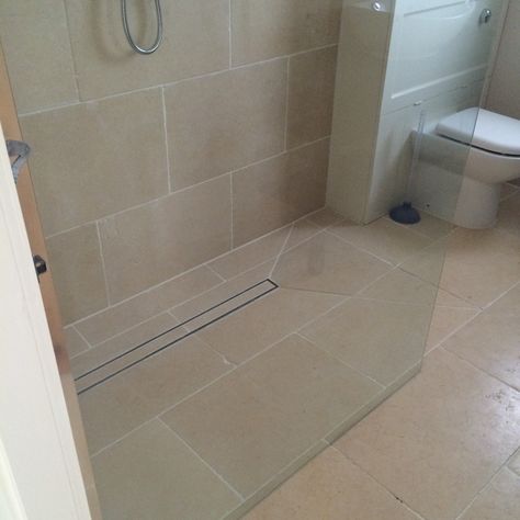 Wet room , tiles are Jerusalem marble. the unit behind the toilet made on site , the falls within the tray area formed by ourselves to allow the screed to have a quick drainage. Underfloor heating installed , Jasmine grout , a nice room. Wet Room Tiles, Nice Room, Wet Room, Room Tiles, Underfloor Heating, Wet Rooms, Grout, Shower Room, Cool Rooms