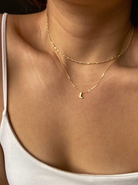 Little letters, BIG impact. The Alphabet Necklace is the perfect way to represent your initial, or your loved ones, in a delicate way. It stacks perfectly with our range of everyday necklaces, found here. Our Alphabet Charms are sliders but not removable from our chains, perfect for those who love to fidget with their pendants. Details: Choose between 14k Gold Vermeil, White Gold vermeil, or Rose Gold vermeil Adjustable at 42cm and 45cm lengths. Hand made by manual wax casting to give it a sligh Pendant Necklace Outfit, Letter Necklace Initials, Everyday Necklaces, J Necklace, Jewelry Box Design, Alphabet Charms, Dainty Initial Necklace, Alphabet Necklace, Pendant Necklace Simple